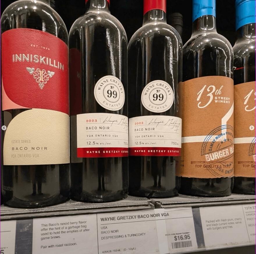 Bottles of Wayne Gretzky Baco Noir labelled "USA. Baco Noir. Depressing & Turncoating." Product description: "This Baco's rancid berry flavour offers the hint of a garbage bag used to hold the empties of after game brews. Pair with roast raccoon." $16.95