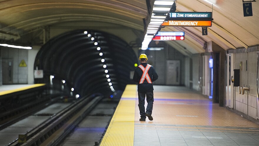 Montreal Metro A Montreal Metro maintenance worker walks along a station platform during the early hours of the morning in Montreal, Thursday, April 11, 2019. THE CANADIAN PRESS/Graham Hughes