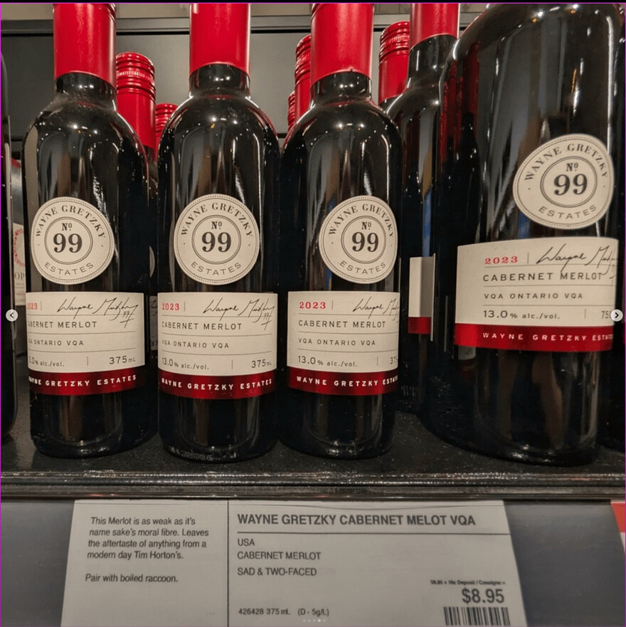 Bottles of Wayne Gretzky Cabarnet Merlot wine with a label saying: "USA, Cabarnet Merlot, Sad & Two Faced." Description: "This Merlot is as weak as its namesake's moral fibre. Leaves the aftertaste of anything from a modern day Tim Horton's. Pair with boiled raccoon." $8.95