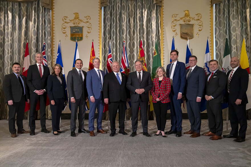 Canada's premiers pose for a group photograph before speaking to reporters at the Mayflower Hotel in Washington, Wednesday, Feb. 12, 2025. Photo by: The Canadian Press/AP/Ben Curtis