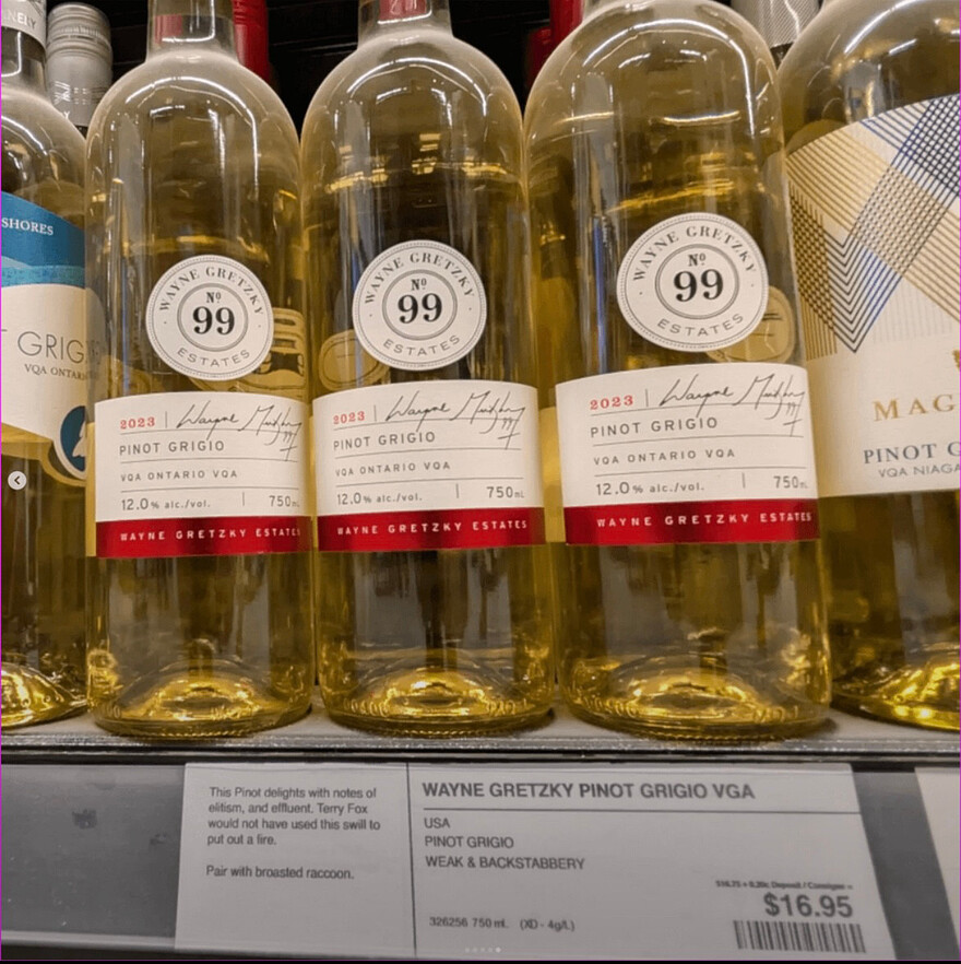 Bottles of Wayne Gretzky Pinot Grigio labelled "USA. Pinot Grigio. Weak & Backstabbery." Product description: "This Pinot delights with notes of elitism and effluent. Terry Fox would not have used this swill to put out a fire. Pair with broasted raccoon." $16.95