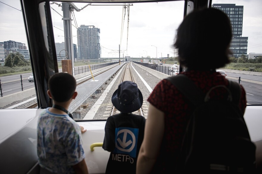 Visitors ride the Reseau Express Metropolitain (REM) light rail during its inauguration ceremony in Montreal, Quebec, Canada, on Friday, July 28, 2023.