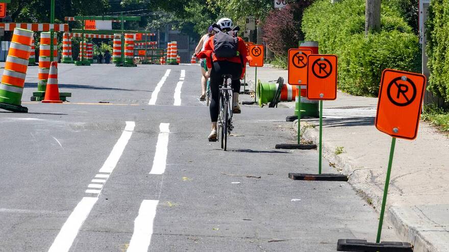 Cyclists rides on the newly-created bike path on Terrebonne St. in the NDG district of Montreal Tuesday June 25, 2024. John Mahoney Montreal Gazette