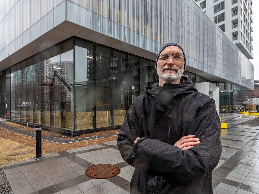 Eric Michaud has called for a public inquiry into how the city of Montreal allowed the social housing units that were planned for the former Children's site to be abandoned. Michaud outside the future SANAAQ location in Montreal on Monday April 17, 2023.
