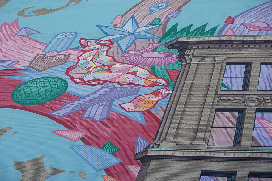 Rafael Sottolichio a peint sur le mur des références architecturales de Montréal, comme la Place Ville Marie, le Stade olympique, le pont Jacques-Cartier et la basilique Notre-Dame.