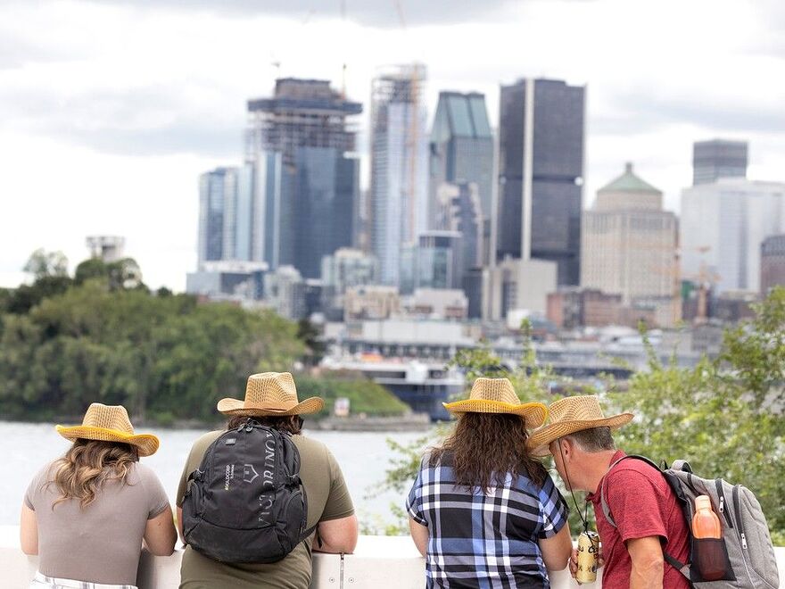 Country music fans take pictures of the skyline as they attend the Lasso country music festival in 2022.