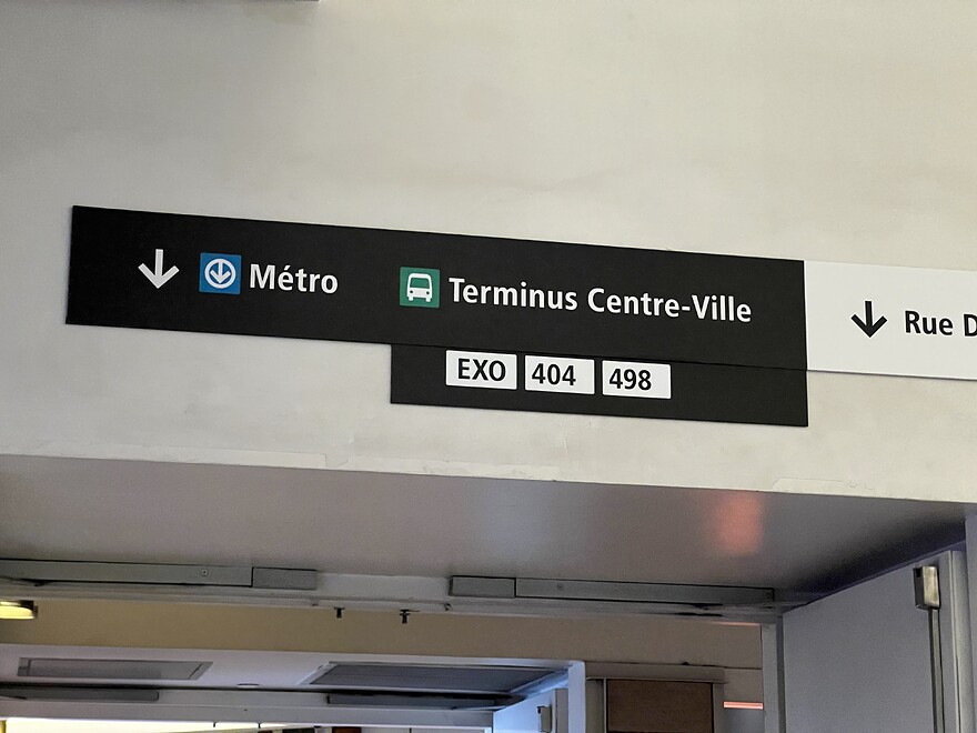Sign above doorway near REM access in Gare Centrale pointing towards Métro and Terminus Centre-Ville