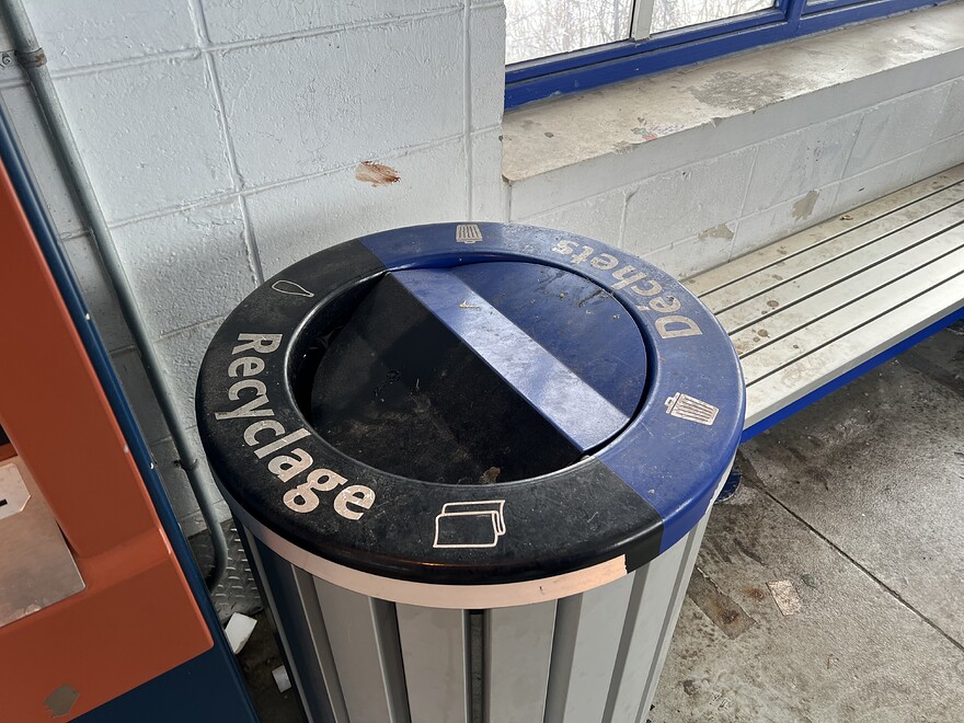 Recycling in black, trash in blue