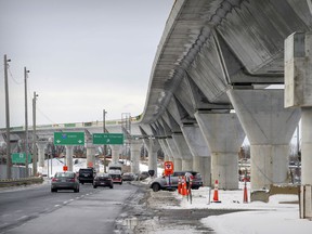 MONTREAL, QUE.: DECEMBER 10, 2020 -- Cars pass under the REM train tracks in Kirkland, west of Montreal Thursday December 10, 2020. (John Mahoney / MONTREAL GAZETTE) ORG XMIT: - 4460