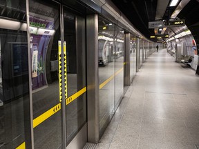 Platform screen doors are visible at Westminster underground station in London.
