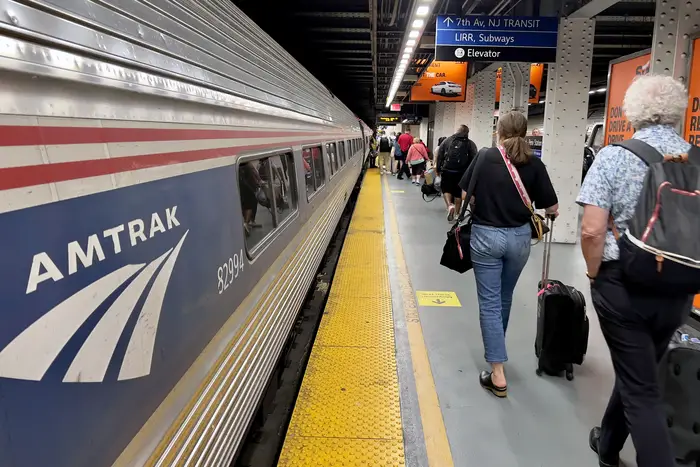 Amtrak passengers leave a train at Penn Station in New York City on July 13, 2023.