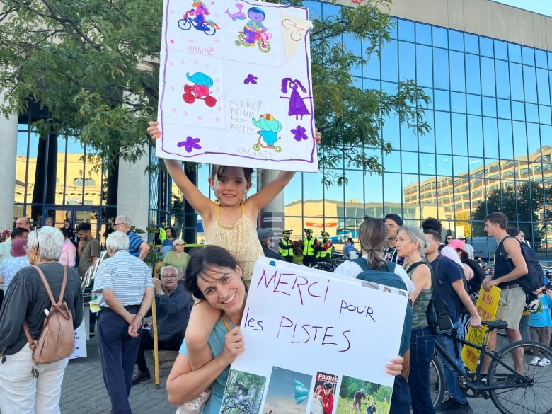 child and woman protesting