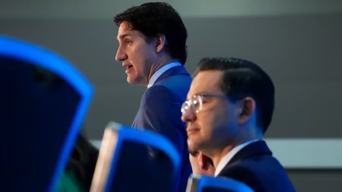 Prime Minister Justin Trudeau and Conservative Leader Pierre Poilievre take part in the National Prayer Breakfast in Ottawa on Tuesday, May 30, 2023. (Sean Kilpatrick/The Canadian Press)
