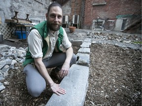 Jean-Philippe Riopel is seen next to a stone foundation he discovered while helping a friend garden in Chinatown.