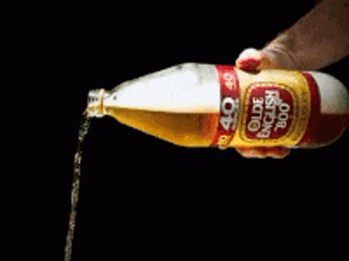 a bottle of olde english 800 is being poured into someone 's hand